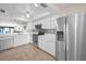 Well-lit kitchen with stainless steel appliances, white cabinets, and an open design for modern living at 55 Rogers St # 502, Clearwater, FL 33756