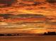 Scenic sunset view over the water, featuring clouds, silhouetted skyline, and bridge at 55 Rogers St # 502, Clearwater, FL 33756