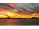Beautiful sunset view over the water with a bridge and cityscape in the background, creating a stunning backdrop at 55 Rogers St # 502, Clearwater, FL 33756