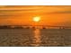 Stunning waterfront view featuring a silhouette of bridge and sunset reflection on the water at 55 Rogers St # 502, Clearwater, FL 33756