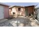 Backyard with brick ground cover, fence, external AC units, and pink external walls at 5601 Golden Dr, Tampa, FL 33634
