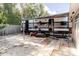 Backyard showing a Pioneer trailer, exterior seating, grass, and partial brick ground cover at 5601 Golden Dr, Tampa, FL 33634