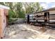 Backyard with a Pioneer trailer, small tree, exterior seating, and a wood fence at 5601 Golden Dr, Tampa, FL 33634
