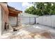 The backyard brick patio with an AC unit and storage shed is ready for new owners at 5601 Golden Dr, Tampa, FL 33634