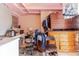 Basement featuring an office, built-in storage, and various furniture at 5601 Golden Dr, Tampa, FL 33634