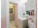 Well-lit bathroom featuring a contemporary vanity, and open storage at 5601 Golden Dr, Tampa, FL 33634