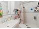Updated bathroom featuring modern fixtures, stylish vanity, and tiled shower with recessed shelves at 5601 Golden Dr, Tampa, FL 33634