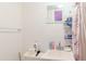 Functional bathroom featuring a sink, shower with curtain, and ample storage at 5601 Golden Dr, Tampa, FL 33634