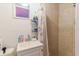 Modest bathroom showcasing a tiled shower and compact vanity at 5601 Golden Dr, Tampa, FL 33634