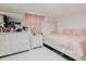 Bedroom featuring white furniture, a bed, and white tile flooring at 5601 Golden Dr, Tampa, FL 33634