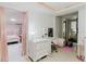 Bright bedroom featuring a functional workstation, modern lighting, and comfortable decor elements at 5601 Golden Dr, Tampa, FL 33634