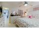 A bedroom with a view of a dressing area and a glimpse into the bathroom at 5601 Golden Dr, Tampa, FL 33634