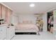 Cozy bedroom with a luxurious bed, dresser, and closet space offers a peaceful retreat at 5601 Golden Dr, Tampa, FL 33634