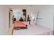 Bedroom featuring cozy bedding, bright lighting, and comfortable decor elements at 5601 Golden Dr, Tampa, FL 33634