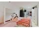 Bedroom featuring cozy bedding, bright lighting, and comfortable decor elements at 5601 Golden Dr, Tampa, FL 33634
