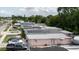 A house with solar panels, air conditioning, and a parking area for multiple vehicles at 5601 Golden Dr, Tampa, FL 33634