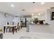 Bright dining area adjacent to a modern kitchen with stainless steel appliances and bar seating at 5601 Golden Dr, Tampa, FL 33634