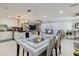 Open concept living and dining area featuring modern decor, stylish furnishings, and ample natural light at 5601 Golden Dr, Tampa, FL 33634