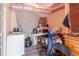 Room with temporary kitchen setup, exposed ceiling, and basic furnishings at 5601 Golden Dr, Tampa, FL 33634