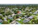 Aerial view of a neighborhood featuring tree-lined streets, well-maintained homes, and a coastal backdrop at 5725 18Th S Ave, Gulfport, FL 33707
