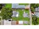 Aerial view of property with lush backyard, detached garages, and neighboring houses in a residential area at 5725 18Th S Ave, Gulfport, FL 33707