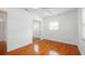 Bedroom featuring gleaming hardwood floors, a ceiling fan, and a mirrored closet at 5725 18Th S Ave, Gulfport, FL 33707