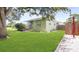 Well-maintained exterior with green grass and mature landscaping at 5725 18Th S Ave, Gulfport, FL 33707