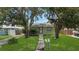 Charming single-story home with a well-maintained lawn and mature trees at 5725 18Th S Ave, Gulfport, FL 33707