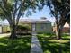 Charming single-story home with a well-maintained front yard and mature shade trees at 5725 18Th S Ave, Gulfport, FL 33707