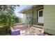 Inviting front porch with tiled steps and decorative iron railings at 5725 18Th S Ave, Gulfport, FL 33707