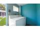 Bright laundry room with a washer and dryer. Door leads to backyard at 5725 18Th S Ave, Gulfport, FL 33707