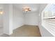 Open-concept living room with tile floors and a ceiling fan at 5725 18Th S Ave, Gulfport, FL 33707