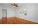 Bright living room featuring ceiling fan, gleaming hardwood floors, and lots of light at 5725 18Th S Ave, Gulfport, FL 33707
