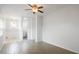 Bright living room with tile floors, white walls, and ceiling fan at 5725 18Th S Ave, Gulfport, FL 33707