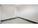 A spacious room featuring tiled flooring, neutral walls, and a glimpse into the connecting hallway at 5725 18Th S Ave, Gulfport, FL 33707