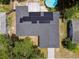 Aerial view of a home with solar panels on the roof at 6200 13Th Ave, New Port Richey, FL 34653
