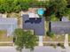 Aerial view of a neighborhood home featuring solar panels on roof at 6200 13Th Ave, New Port Richey, FL 34653