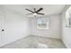 Bedroom featuring a ceiling fan, neutral paint, and large windows that let in plenty of natural light at 6200 13Th Ave, New Port Richey, FL 34653
