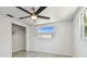 Bedroom with a window, closet, and ceiling fan at 6200 13Th Ave, New Port Richey, FL 34653