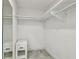 A spacious closet with shelving, and a gray marble-like tile floor at 6200 13Th Ave, New Port Richey, FL 34653