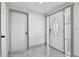 Bright entryway boasts tile floors and an exterior door with glass sidelights, offering a welcoming ambiance at 6200 13Th Ave, New Port Richey, FL 34653