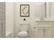 Bright, clean bathroom featuring a shower/tub, toilet, vanity with a white cabinet, and quartz countertop at 6611 Active Run, New Port Richey, FL 34653