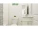 Spotless bathroom design includes a white vanity, toilet, and bath with neutral finishes, and modern accents at 6611 Active Run, New Port Richey, FL 34653