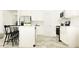 Bright eat-in kitchen featuring white cabinets, an island, and stainless steel appliances at 6611 Active Run, New Port Richey, FL 34653