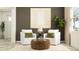 Cozy living room featuring comfortable seating, a stylish coffee table, modern decor, and a warm ambiance at 6611 Active Run, New Port Richey, FL 34653