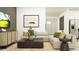 Stylish living room with a comfortable sofa, modern decor, and a wall-mounted TV at 6611 Active Run, New Port Richey, FL 34653