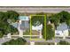 Birds eye view of property, showing the house surrounded by trees and the proximity to the train tracks at 706 E Gate Dr, Safety Harbor, FL 34695