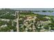 Aerial view of neighborhood with a nearby lake and baseball field at 706 E Gate Dr, Safety Harbor, FL 34695
