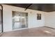 Covered brick back porch with a sliding glass door and lots of space at 706 E Gate Dr, Safety Harbor, FL 34695