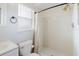 Bright bathroom with white tile shower, modern fixtures, and updated vanity at 706 E Gate Dr, Safety Harbor, FL 34695